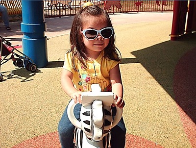 a child rocking on a rocking horse